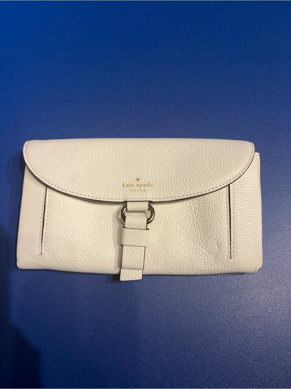 kate spade White Pebbled Leather Buckle Wallet